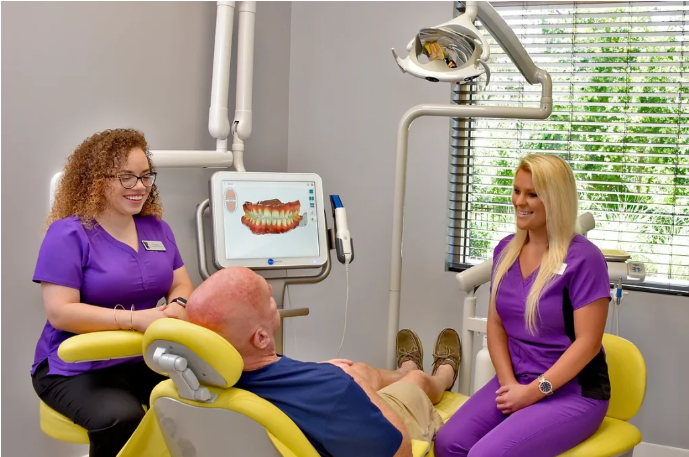 patient talking to dental staff