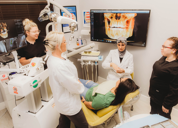 dental staff working with a patient